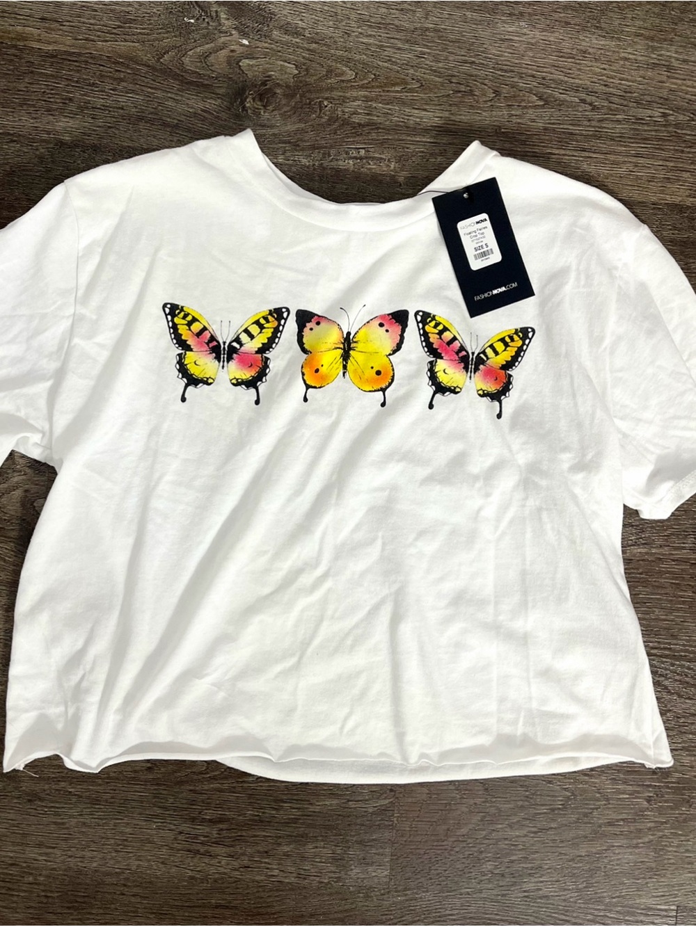 Fashion Nova White Butterfly Graphic Tee with Yellow and Pink Accents